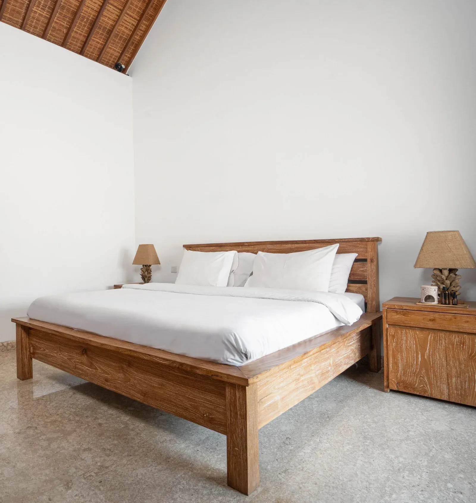 Deluxe Double Room bed in morning light
