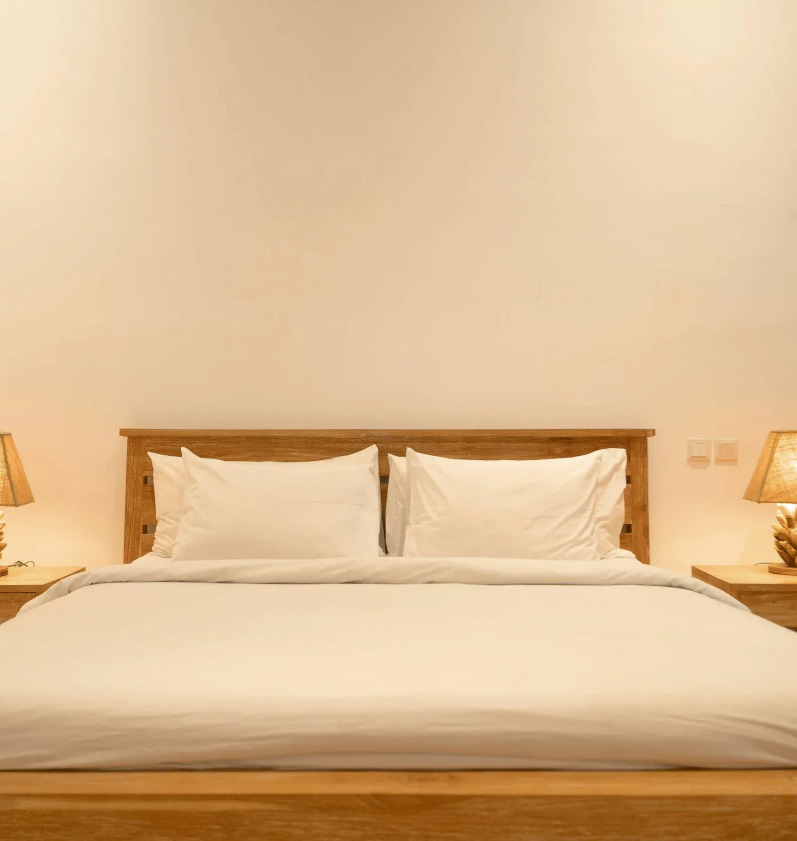 King Room bed with lamp at night